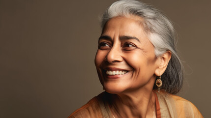 An Indian senior woman's warm smile enhances her classic beauty. Generative AI