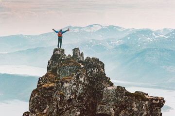 Wall Mural - man climbing mountain in norway adventure travel outdoor extreme active lifestyle vacations tour hik