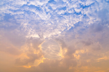 Wall Mural - sunset / sun rise sky with rays of yellow and red light shining clouds and sky background and textur