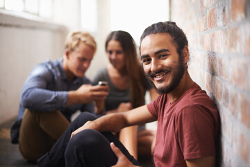 University, happy and portrait of man with friends for education, knowledge and learning. College, academy scholarship and male student smile in hallway on campus for studying, class or school
