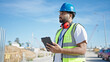 © Krakenimages.com - African american man builder using touchpad at street