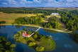Deg, Hungary - Aerial panoramic view of the beautiful Holland house (Hollandi haz) on a small island at the village of Deg with Festetics Palace at background on a summer morning with blue sky