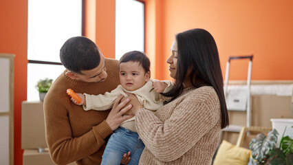 Poster - Couple and son hugging each other standing at new home