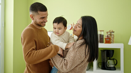 Sticker - Couple and son hugging each other standing at home