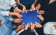 Leinwandbild Motiv Diverse corporate officer workers collaborate in office, connecting puzzle pieces to represent partnership and teamwork. Unity and synergy in business concept by merging jigsaw puzzle. Concord