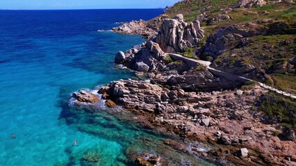 Wall Mural - Italy summer holidays. Sardegnia island . village Santa Teresa di Galura in northern part with turquoise sea and beautiful beach . aerial drone video