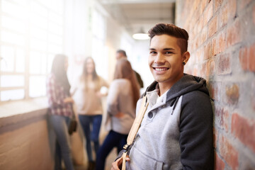 Sticker - Education, smile and portrait of man in college hallway for studying, learning and scholarship. Future, happy and knowledge with student relax on brick wall for university, academy and campus