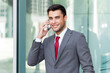 © Minerva Studio - Portrait of a businessman using his mobile phone