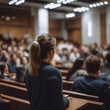 © Bendix - Person listening, a speech of a woman in conference hall
