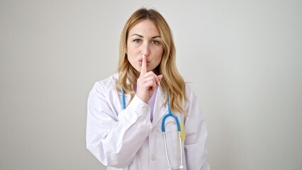 Poster - Young beautiful hispanic woman doctor asking for silent over isolated white background