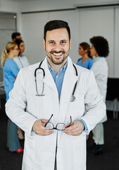 Wall Mural - doctor nurse portrait man hospital group team medical uniform health surgeon adult stethoscope smiling professional clinic medicine male happy female occupation teamwork care