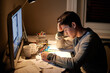 © Marius Venter/peopleimages.com - Man, studying and stress in night by computer for test, assessment or headache in college dorm. Male university student, education and burnout with anxiety, fatigue and tired with books for learning