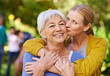 © Mariusz/peopleimages.com - Senior mother, woman and kiss in nature, outdoor and portrait with love, care and trees on holiday. Elderly mama, lady and embrace with bond, excited face and support in backyard with summer sunshine