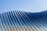 Fototapeta Panele - architecture and site concept - close up of modern building construction part over blue sky