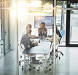 © Thurstan H/peopleimages.com - Business, training, and people in office with mentor for planning, discussion and problem solving. Coaching, collaboration and woman leader with team in boardroom for sharing vision, growth and idea