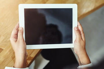 Wall Mural - Hands, tablet and screen with a business person working online in the office for information research. Technology, internet and display with a corporate employee accessing a database from above