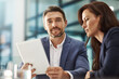 © GR/peopleimages.com - Meeting, tablet and planning with a business team in the office for research on a company project. Teamwork, portrait or technology with a corporate man and woman in collaboration together at work