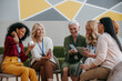 © gstockstudio - Group of happy mature women examining beauty products during specialized conference
