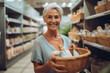 © wetzkaz - mature adult woman in a supermarket between two product shelves, smiling happy, blonde caucasian