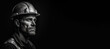 © JoelMasson - Black and white photorealistic studio portrait of a construction worker with hard hat on black background. Generative AI illustration