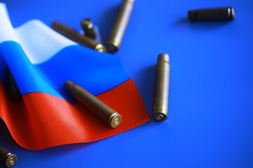 Wall Mural - Russian flag and bullet casings on the table. Background concept Russian army.