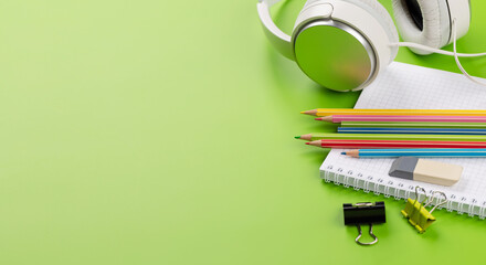 School supplies and stationery on green