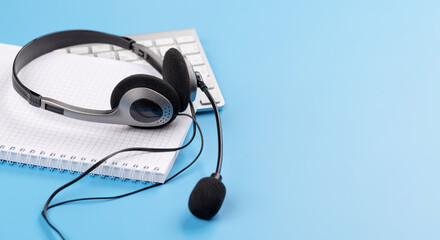 Wall Mural - Headset on a computer keyboard