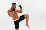 Fototapeta Przeznaczenie - Man athletic bodybuilder poses in boxing gloves with nude torso abs in full-length background, boxing and martial arts. Advertising, sports, active lifestyle, competition, challenge concept. 