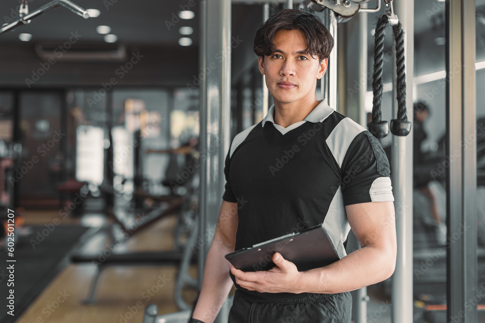male muscle coach weight program trainer standing in gym sport club ...