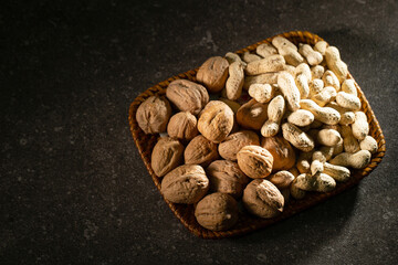 Canvas Print - Peanuts and walnuts on a plate