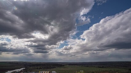 Wall Mural - dark beautiful clouds, dramatic sky over a beautiful valley. the clouds are moving forward. 4k timel