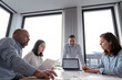 © Westend61 - Business people working together on an architectural project in office