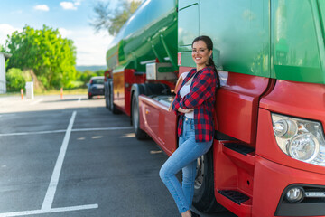 A young woman poses in front of her first cargo truck before embarking on a cross-country tour