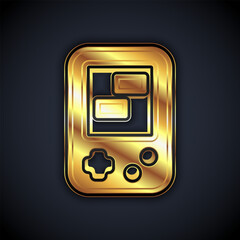 Poster - Gold Portable tetris electronic game icon isolated on black background. Vintage style pocket brick game. Interactive playing device. Vector