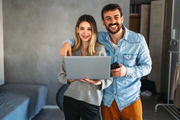 Wall Mural - Portrait of success business people working together in home office. Couple teamwork startup concept