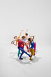© master1305 - Expressive, artistic female ballet dancers in bright, multicolored clothes performing, dancing against grey background. Concept of beauty, creativity, classic dance style, elegance, contemporary art
