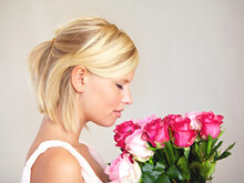 Smelling, Side Profile And Woman With Flowers As A Gift Isolated On A White Studio Background. Aroma Scent, Romantic And Girl With A Bouquet Of Roses For Valentines Day Or Anniversary On A Backdrop