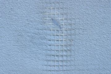 Poster - texture of a white plastic mesh on a gray concrete wall