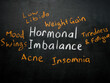 Handwritten Hormonal imbalance sign on the blackboard.