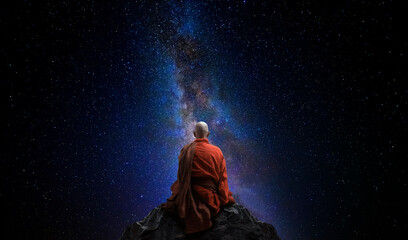 Wall Mural - Buddhist monk looking at the universe. AI generative