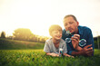 © Ruan J/peopleimages.com - Garden, family and father and boy with bubble for quality time, bonding and having fun together. Summer, parenthood and happy dad and child blowing bubbles in park for playing, happiness and relaxing