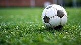 Fototapeta Sport - Soccer ball on the football field. Generative ai