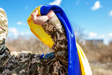 Armed Forces Of Ukraine. Ukrainian Soldier. Military Uniform. Ukrainian Flag. Close Up