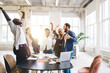 © BullRun - Group of diverse colleagues celebrating victory