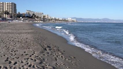 Canvas Print - Benalmadena beach Spain towards Carihuela and Torremolinas Costa del Sol Andalusia Spain with sea and waves