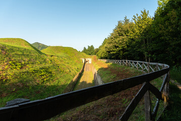 Wall Mural - Green slopes hide the military buildings of the fortress of Guadalupe, Hondarribia, Gipuzkoa, Basque Country, Spain