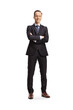 © Ljupco Smokovski - Full length portrait of a businessman standing with folded arms and smiling