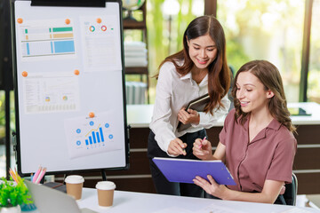 Concept of business investment or working woman, Closeup businesswoman discussing or working on analysis of business investment documents and using computer tablet to analytic business data.