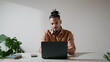 © stockbusters - Modern student typing keyboard at workplace. Focused man watching screen at home
