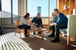 © Flamingo Images - Diverse businesspeople laughing during a meeting in an office lounge